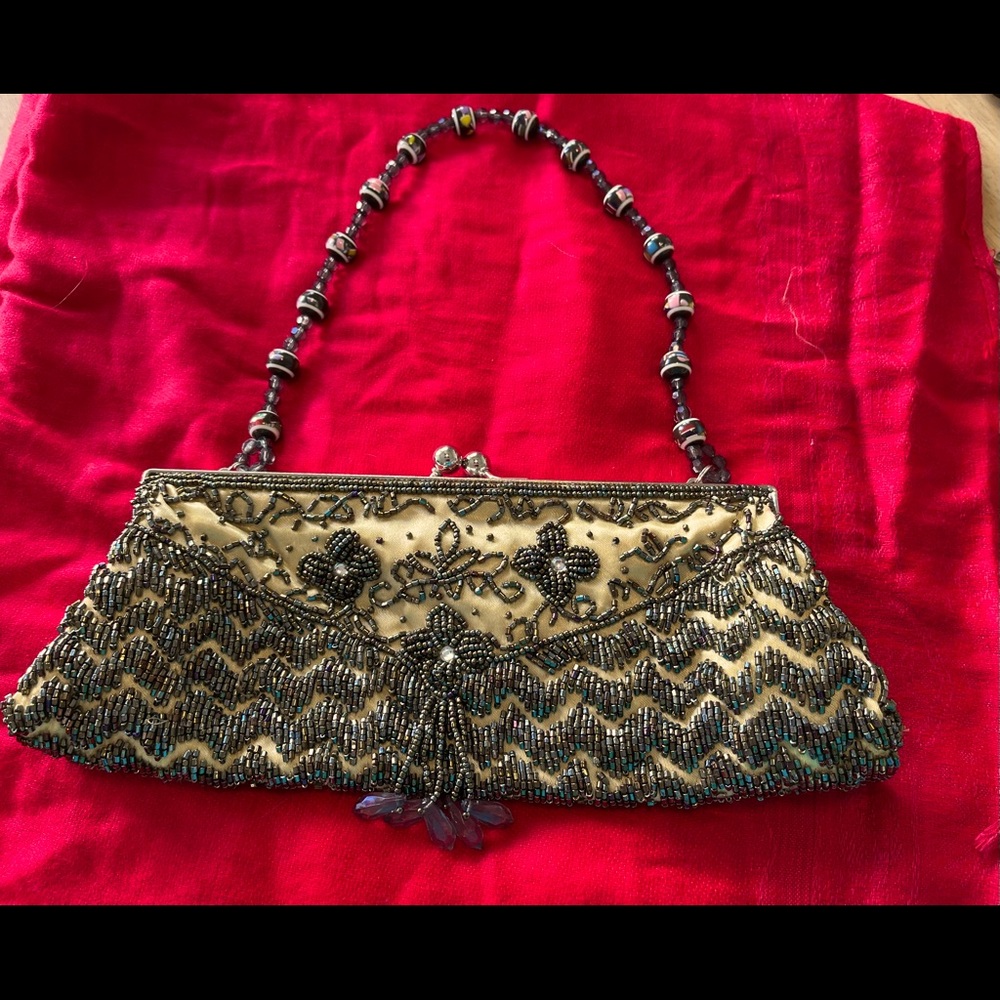 Sweet artfully beaded evening bag with an antique look.  Excellent shape.